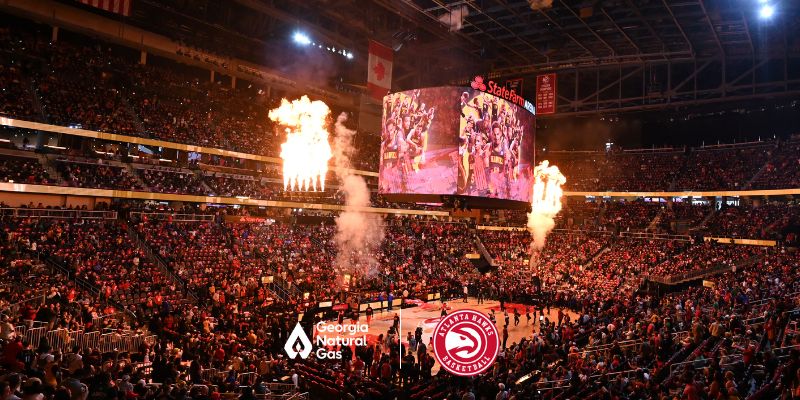 Crowd at Hawks game with fire