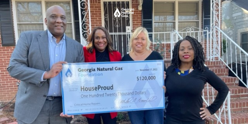 Group of people at a check presentation