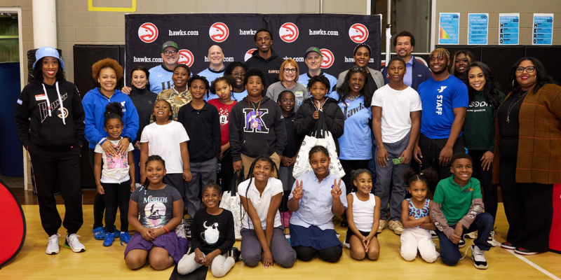 Group of kids and volunteers at Green Grocery Grab event at Arthur M Blank YMCA