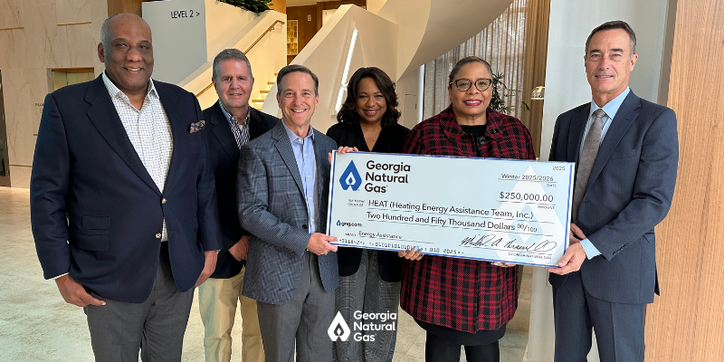 Group of people at a check presentation