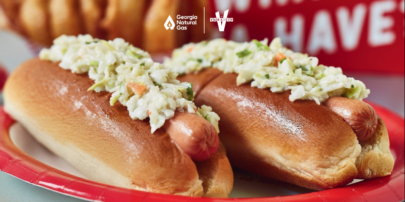 hot dogs on a plate with GNG and The Varsity Logo Lock up