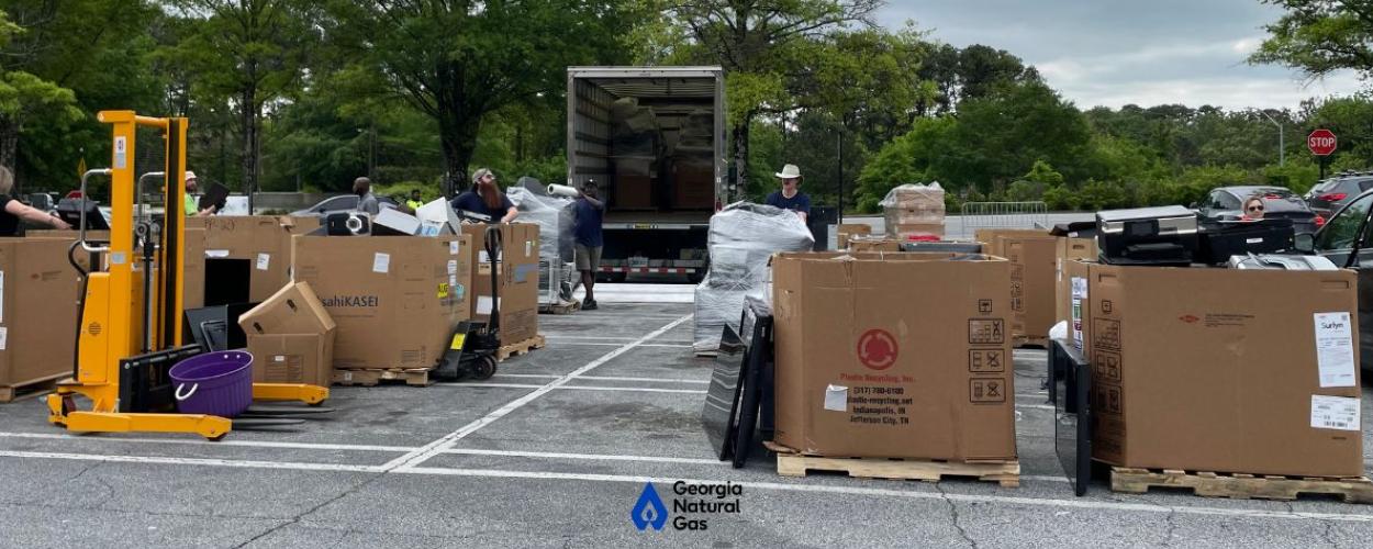 Image of boxes full of electronics from electronic recycling event