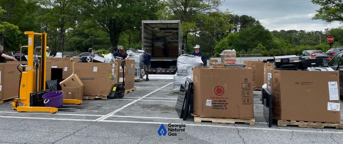 Image of boxes full of electronics from electronic recycling event