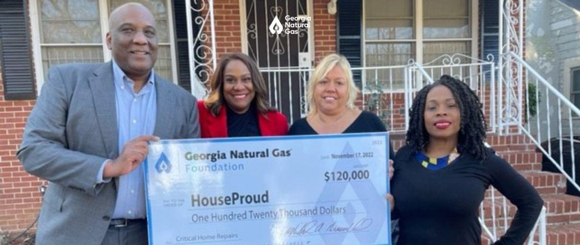 Group of people at a check presentation