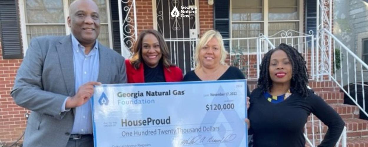 Group of people at a check presentation
