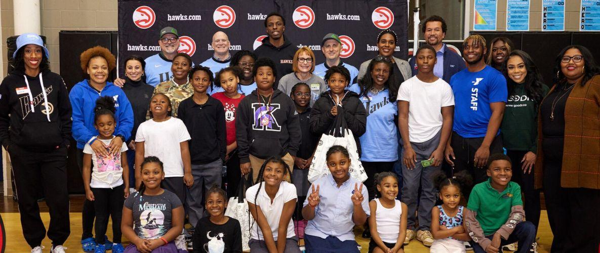 Group of kids and volunteers at Green Grocery Grab event at Arthur M Blank YMCA