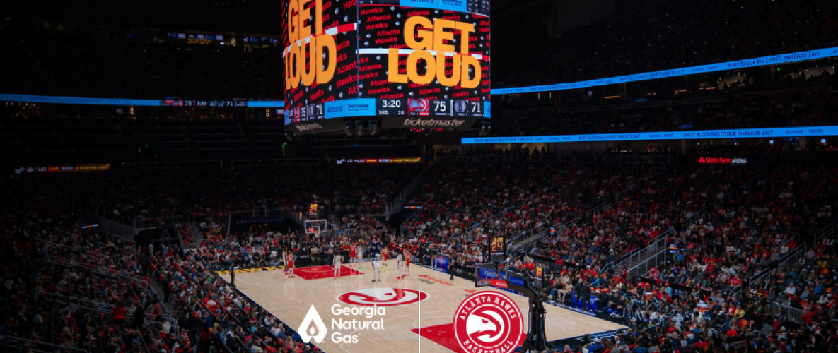 Basketball court with "Get Loud" on the screen and the GNG and Atlanta Hawks Logo